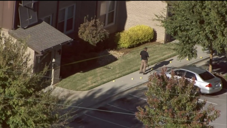 Police lights flash at night in a suburban North Georgia neighborhood, symbolizing an ongoing investigation.